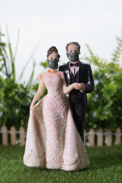 Wedding couple during coronavirus with mask onAdvice for Couples Impacted by the Coronavirus