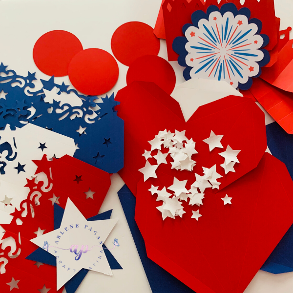cut outs to make paper rosettes from Cricut machine in red, white and blue paper
